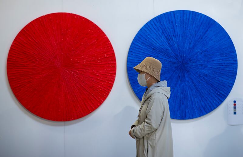 A visitor walks in front of an untitled artwork by Turkish artist Melek Toraman during Contemporary Istanbul. EPA