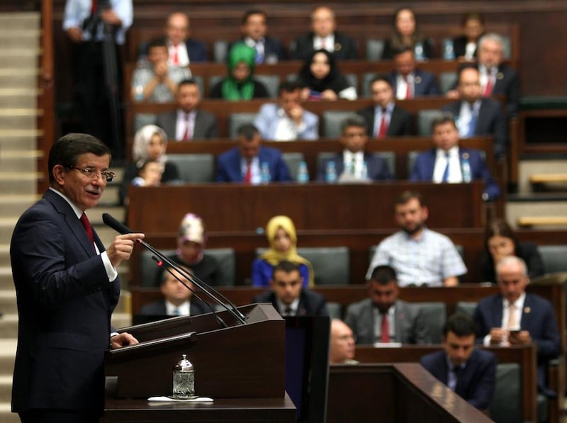 Turkey's prime minister Ahmet Davutoglu addresses MPs from his AK Party before an emergency session of parliament to discuss Ankara's "anti-terror" operation . EPA/STR