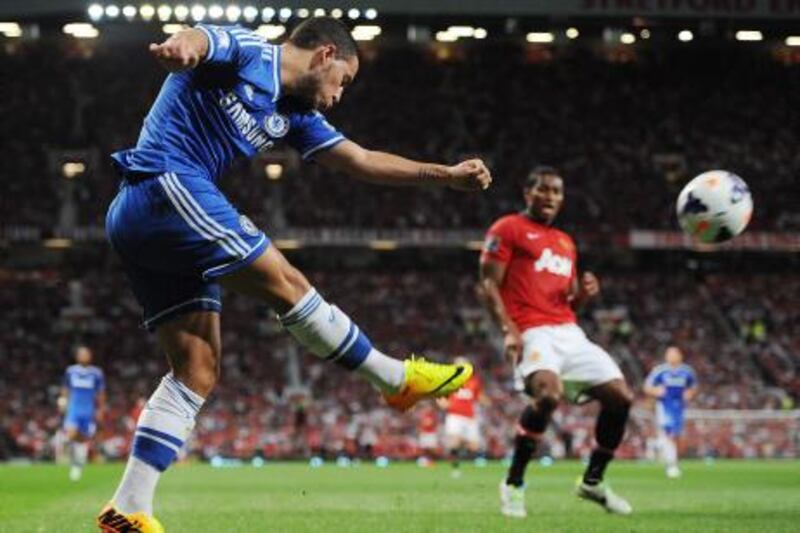 epa03838598 Chelsea's Eden Hazard (L) fires the ball into the box during the English Premier League soccer match between Manchester United and Chelsea at Old Trafford, Manchester, Britain, 26 August 2013.  EPA/PETER POWELL DataCo terms and conditions apply https://www.epa.eu/downloads/DataCo-TCs.pdf *** Local Caption ***  03838598.jpg