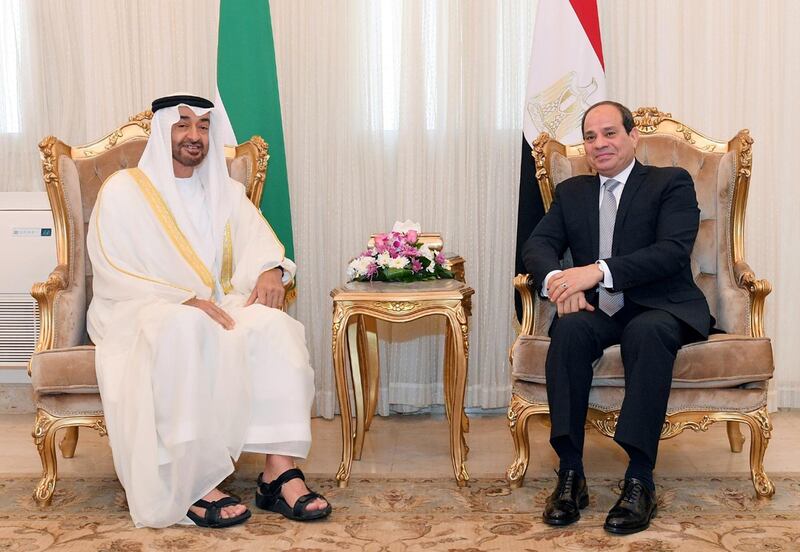 Sheikh Mohamed sits with President Sisi. EPA