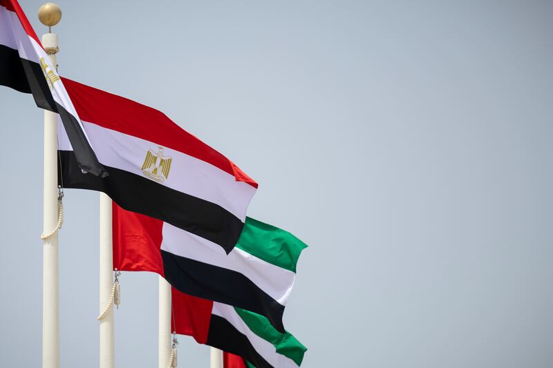 The Egyptian and UAE flags are raised for Mr El Sisi's departure