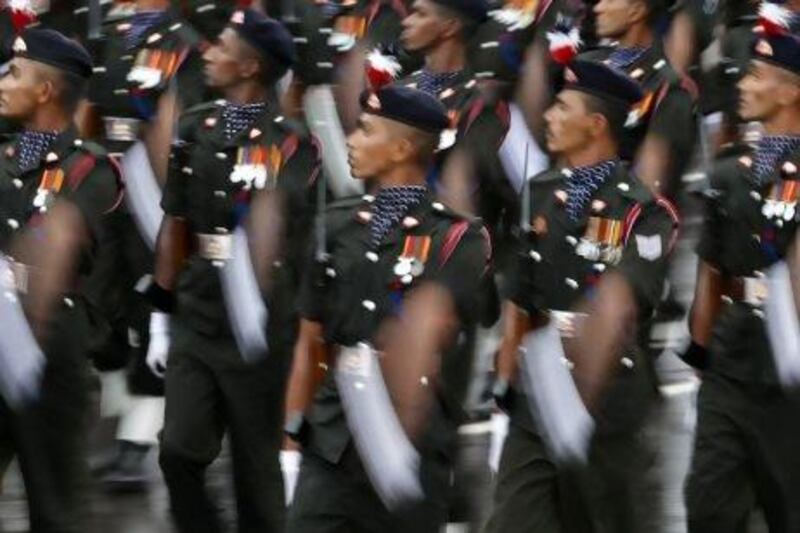 Sri Lankan Army soldiers march during a parade celebrating Sri Lanka's 65th Independence Day, marking the country's independence from British colonial rule in 1948 in Trincomalee, Sri Lanka, Monday, Feb. 4, 2013. (AP Photo/Eranga Jayawardena) *** Local Caption *** Sri Lanka Independence Day.JPEG-0253d.jpg