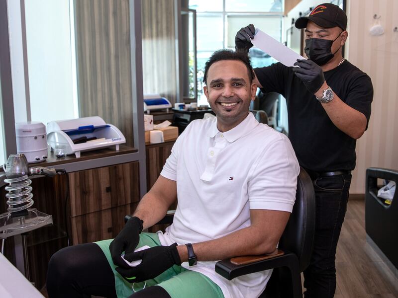 Mr Al Mubarak, 34, at Urban Cuts Barbershop in Abu Dhabi.