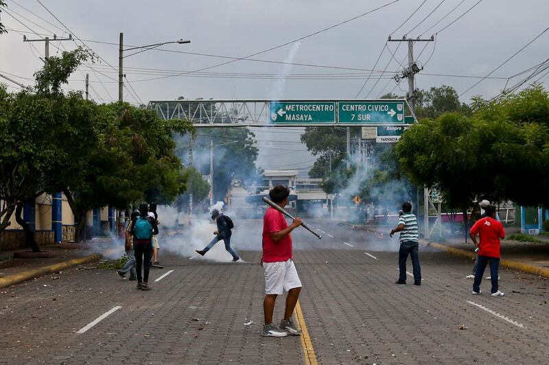 University students clash with riot police during a protest against Nicaragua's President Daniel Ortega in Managua, Nicaragua. Esteban Felix / AP Photo