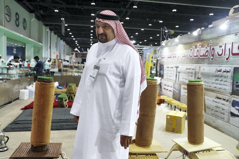 ABU DHABI , UNITED ARAB EMIRATES , SEP 12  ��� 2017 : - Mokhles Aljoanei explaining about the shaking stands for Falcon at the Sinjar Falcon & Hunting Equipment stand on the first day of the ADIHEX 2017 held at  Abu Dhabi National Exhibition Centre in Abu Dhabi. ( Pawan Singh / The National ) Story by Anna