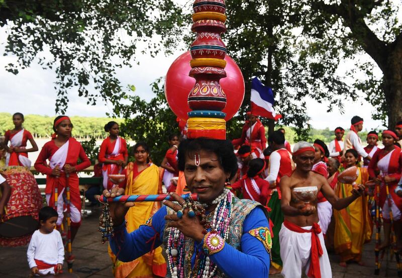 Indian traditional folk dancers perform to show their support to the French football team in Chandannagar, India. AFP