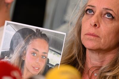 Keren Sherf Shem holds a photo of her daughter Mia Shem, one of the Israelis kidnapped by Hamas. Getty Images