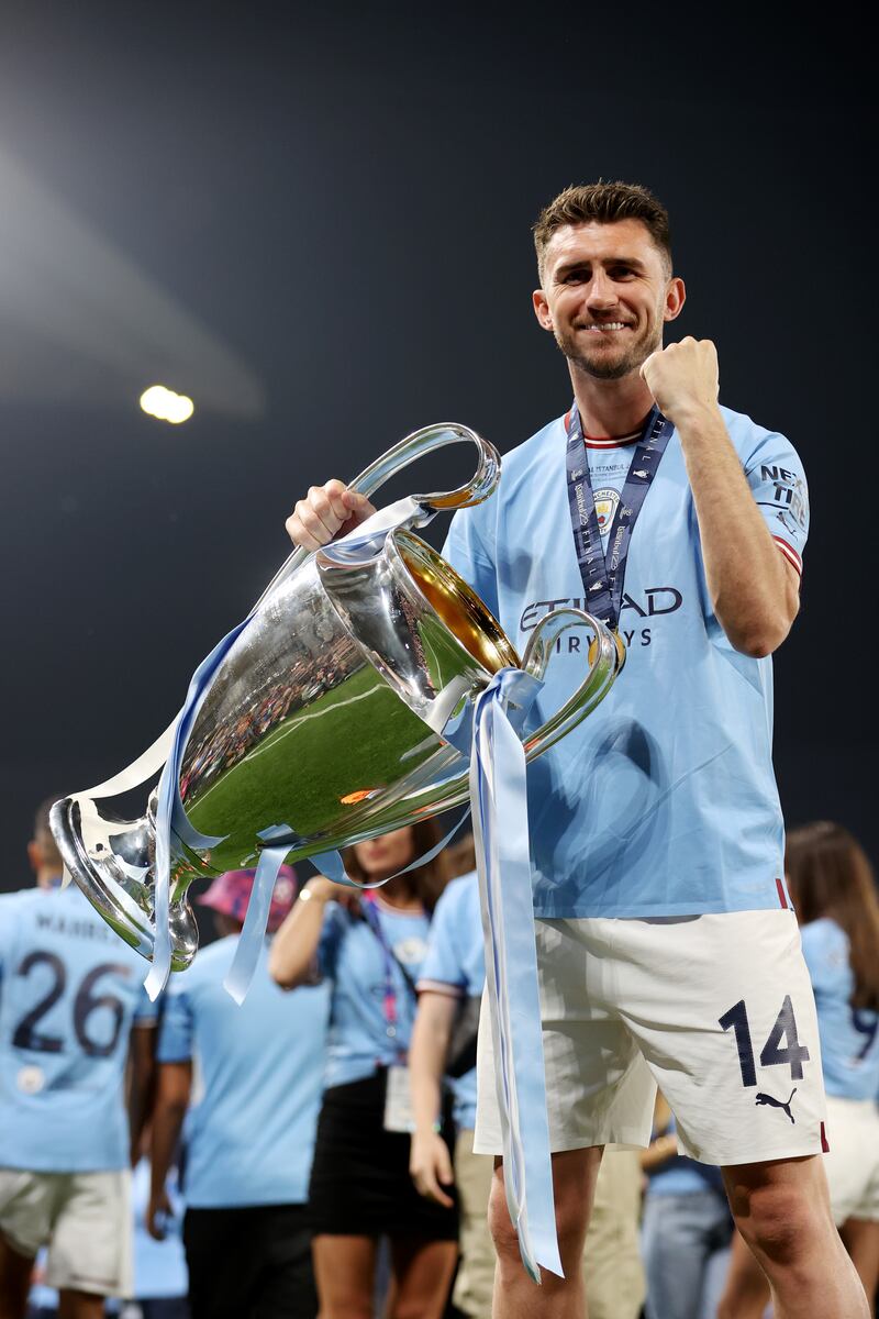 Aymeric Laporte of Manchester City celebrates with the UEFA Champions League trophy. Getty Images