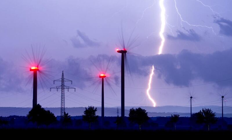 Lightning flashes in the sky over wind turbines in the late evening in Algermissen in the district of Hildesheim, Lower Saxony, Germany. Julia Stratenschulte / EPA