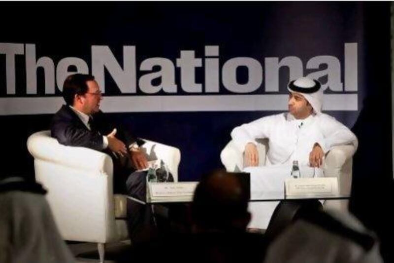 Hamad Al Kaabi, the UAE's permanent representative to the International Atomic Energy Agency, with Tom Ashby, the business editor of The National, at a forum on nuclear energy, organised by The National in Dubai yesterday. Silvia Razgova / The National