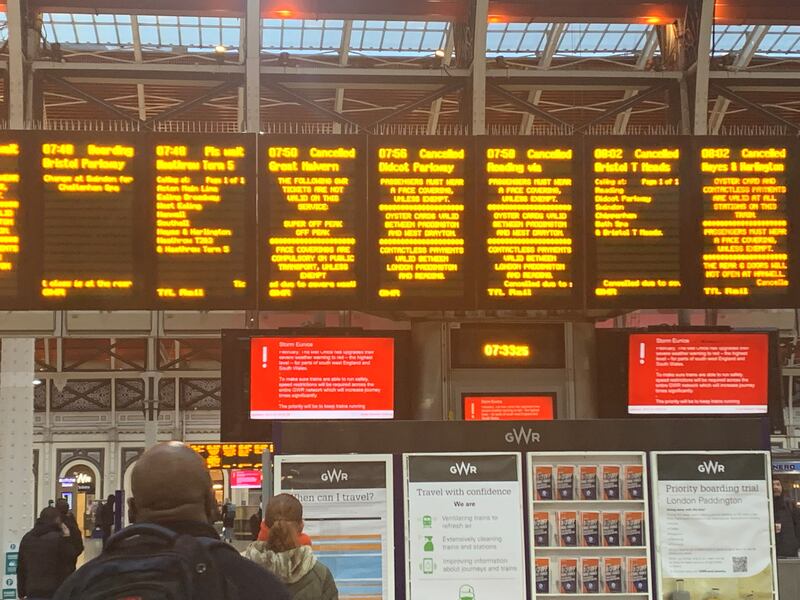 A sign at London's Paddington Station shows cancelled trains after Storm Eunice hit the south coast of England. Millions of people were advised to stay at home by the authorities. PA