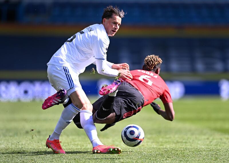 Leeds United's Robin Koch, left, challenges Manchester United's Paul Pogba during their match at Elland Road on Sunday. AP