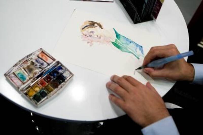 ABU DHABI, UNITED ARAB EMIRATES ‚Äì March 15, 2011: Omar Jaramillo Traverso illustrates a picture of Kate Forrester at Illustrators' Corner during the opening day of the Abu Dhabi International Book Fair at ADNEC.  ( Andrew Henderson / The National )
