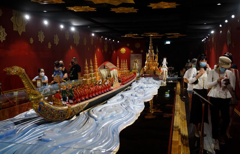 Models of gold and red dragon boats greet visitors, after which short films showcase trade and technology in Thailand. Photo: Expo 2020