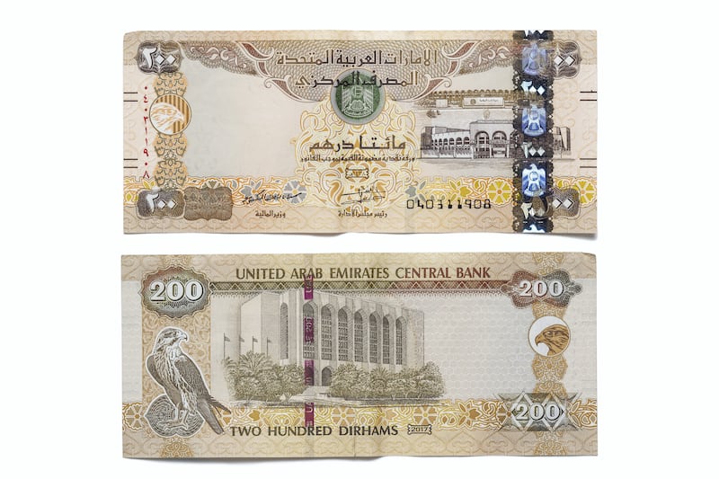 DUBAI, UNITED ARAB EMIRATES. 12 APRIL 2021. United Arab Emirates currency, UAE Money. Two hundred Dirham bank note, 200 aed. (Photo: Antonie Robertson/The National) Journalist: Juman Jarallah. Section: National.