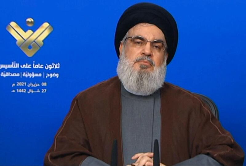 An image grab taken from Hezbollah's al-Manar TV on June 8, 2021, shows the leader of the Lebanese Shiite party Hassan Nasrallah delivering a televised speech from an undisclosed location to mark the anniversary of the TV network.  / AFP / AL-MANAR TV / - / RESTRICTED TO EDITORIAL USE - MANDATORY CREDIT "AFP PHOTO / HO / AL-MANAR" - NO MARKETING NO ADVERTISING CAMPAIGNS - DISTRIBUTED AS A SERVICE TO CLIENTS


