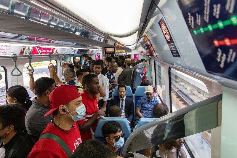 Commuters, some wearing protective face masks, ride the metro in Dubai, United Arab Emirates, on Thursday, March 5, 2020. The Middle East’s travel and business hub has called on citizens and residents to avoid travel due to the coronavirus risk. Photographer: Christopher Pike/Bloomberg