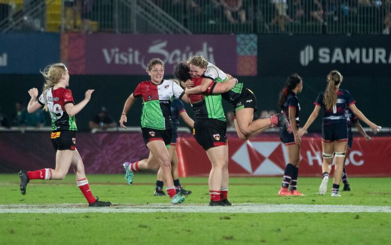 Harlequins celebrate at the final whistle after beating Dubai College in the Gulf Under 19 Girls final.