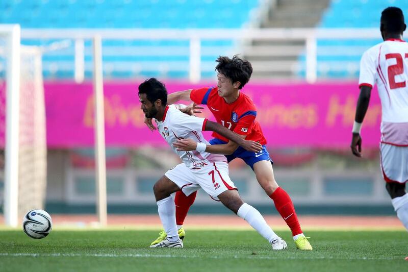 Sultan Bargash, left, of the UAE in action against South Korea during a warm-up match for the Asian Games. Courtesy UAE FA