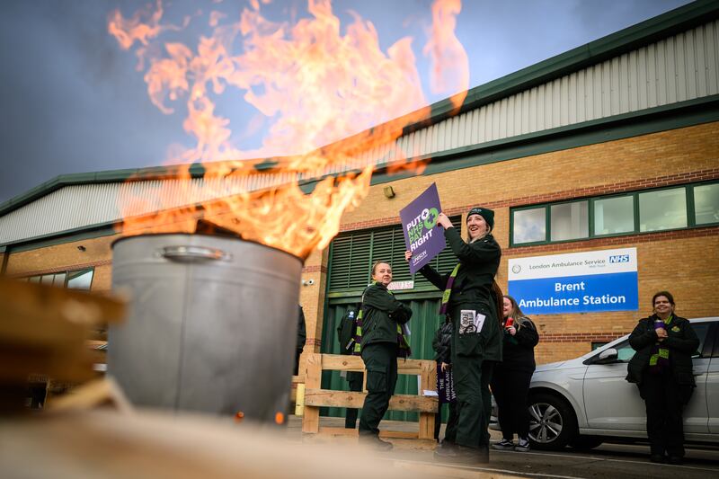 Ambulance workers and supporters gather outside Brent Ambulance Station in London. Getty Images