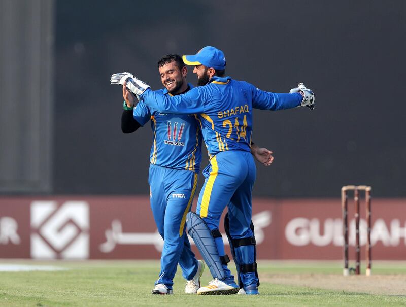 Sharjah, United Arab Emirates - October 06, 2018: Zahir Khan (L) of the Nangarhar Leopards takes the wicket of Asghar Afghan of the Kandahar Knights during the game between Kandahar Knights and Nangarhar Leopards in the Afghanistan Premier League. Saturday, October 6th, 2018 at Sharjah Cricket Stadium, Sharjah. Chris Whiteoak / The National