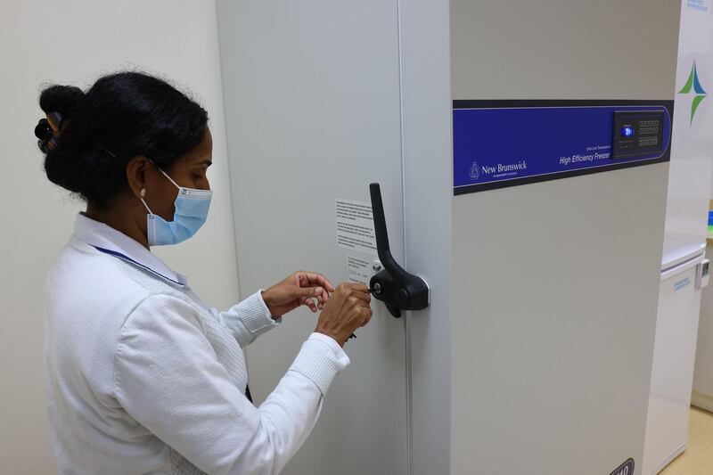 A nurse opens a freezer at Barsha Health Centre. The Pfizer-BioNTech vaccine must be kept at minus 70C when transported.