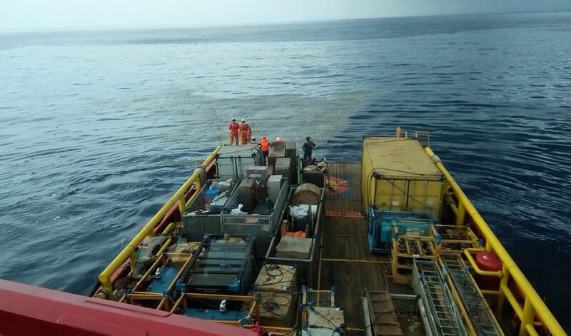 Rescuers inspect oil slick debris believed to be from the Lion Air jet. AP Photo