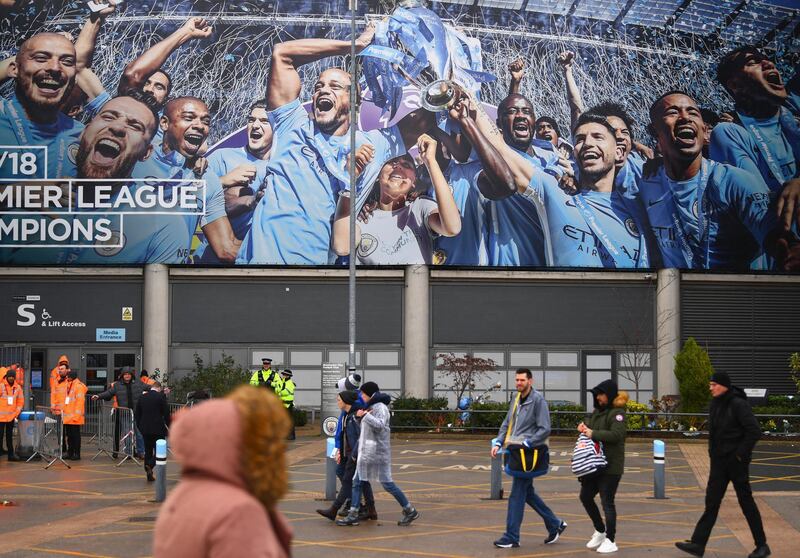 Fans walks outside the stadium prior to the Premier League match. Getty Images