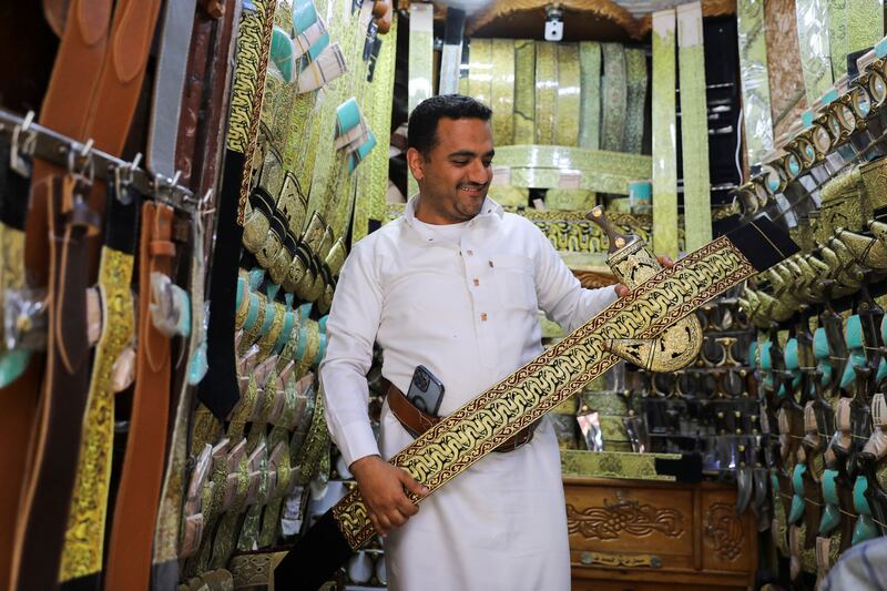 A merchant shows a traditional Yemeni dagger, or jambiya, with its belt of metallic golden threads at his shop in the old quarter of Sanaa, Yemen. All photos: Reuters 