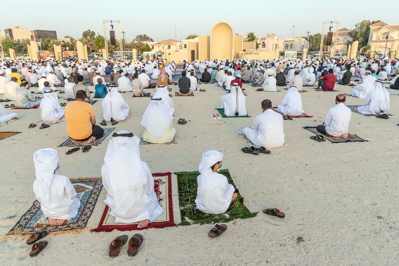 Eid prayers, also known as Salat al-Eid and Șālat al-'Īdayn, is the special prayers (salah) offered to celebrate the Islamic festival at the end of the Holy Month of Ramadan. Traditionally it is held in an open space, Eidgah, such as an allocated spcae or field specifically available for prayer. The UAE Authorities allowed communal Eid prayers again this year with a strict policy of social distancing anf a 15 minite prayer access throughout the UAE after last years locdown due to the Covid - 19 pandemic. Worshippers attend the Eid Prayer at the Umm Suquim Eid prayer grounds on May 13 th, 2021. 
Antonie Robertson / The National.
Reporter: None for National.