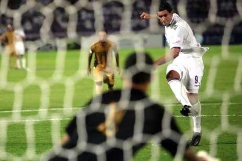 Al Ain's Jose Sand scores from the penalty spot in Pro League action against Dubai.