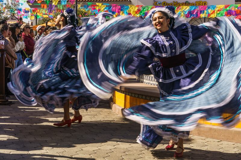 Members of Leyenda Ballet Folklorico from Corona, California, dance during the unveiling ceremony of a four-tonne statue of the late Mexican singer Vicente Fernández at Plaza La Alameda in Walnut Park, Los Angeles County, on Friday. AP