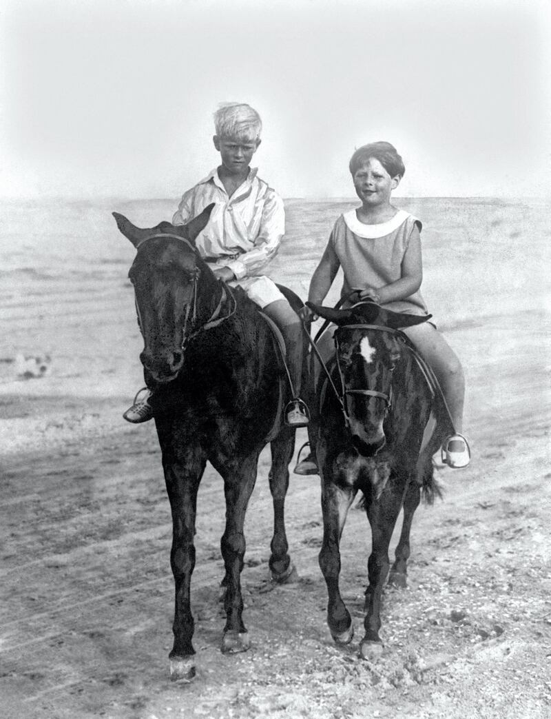 King Michael Of Romania (right) rides with his cousin Prince Philip of Greece on the sands at Constanza.