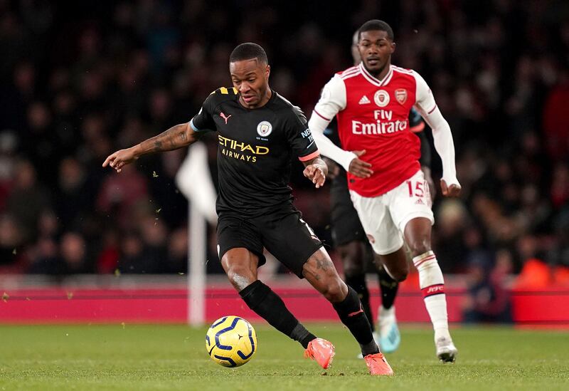 Manchester City's Raheem Sterling, left,  with Arsenal's Ainsley Maitland-Niles. PA