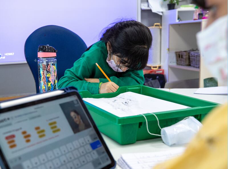 A  pupil busy at lessons at American Academy for Girls in Dubai. Teachers say teaching remotely can make it more difficult to challenge a student who is doing really well, to deepen their understanding.