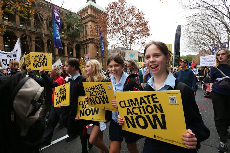 Climate activists march towards the New South Wales Parliament building in Sydney, Australia. Getty Images