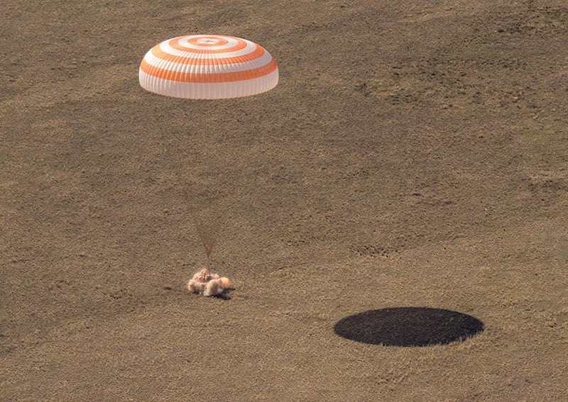This handout photo released by NASA shows the Soyuz MS-17 spacecraft landing in a remote area near the town of Zhezkazgan, Kazakhstan with Expedition 64 crew members Kate Rubins of NASA, Sergey Ryzhikov and Sergey Kud-Sverchkov of Roscosmos, April 17, 2021.  Two Russian cosmonauts and a NASA astronaut touched down Saturday April 17 on the steppe of Kazakhstan following a half-year mission on the International Space Station, footage broadcast by the Russian space agency showed.
Russia's Sergei Ryzhikov and Sergei Kud-Sverchkov as well as NASA's Kate Rubins landed on barren land at 0455 GMT around 150 kilometres (90 miles) southeast of the town of Zhezkazgan.
 - RESTRICTED TO EDITORIAL USE - MANDATORY CREDIT "AFP PHOTO / NASA / Bill INGALLS  " - NO MARKETING - NO ADVERTISING CAMPAIGNS - DISTRIBUTED AS A SERVICE TO CLIENTS
 / AFP / NASA / Bill INGALLS / RESTRICTED TO EDITORIAL USE - MANDATORY CREDIT "AFP PHOTO / NASA / Bill INGALLS  " - NO MARKETING - NO ADVERTISING CAMPAIGNS - DISTRIBUTED AS A SERVICE TO CLIENTS
