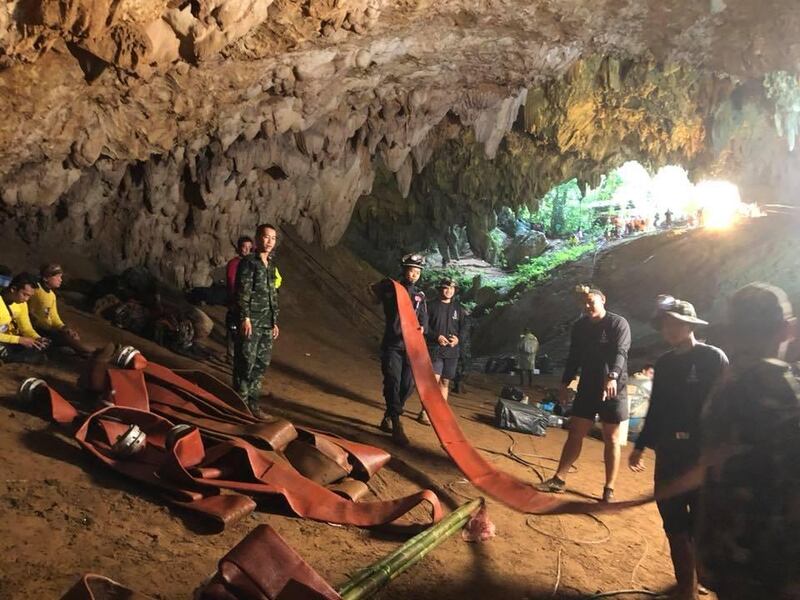 CHIANG RAI, THAILAND - JUNE 27: (EDITORIAL USE ONLY. NO SALES. NO ARCHIVING) An undated handout photo released by the Royal Thai Navy on June 27 shows a group of Thai Navy divers in the Tham Luang cave during rescue operations in Chiang Rai, Thailand. Thai Navy SEALs confirmed on Tuesday that the 12 boys, aged 11 to 16, and their 25-year-old coach have now all been extracted safely 17 days after they got trapped underground alive in a cave in northern the Thailand. The boys of the Wild Boars soccer team and their coach are to spend at least a week in a hospital in Chiang Rai Province and remain under observation due to a risk of rare infections. (Photo by Thai Navy SEAL via Getty Images)