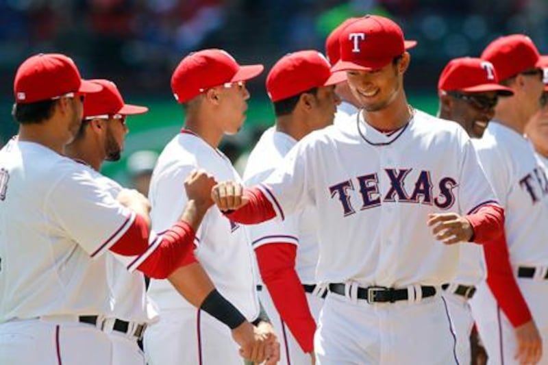 Texas Rangers' Yu Darvish is introduced before the start of their MLB american league baseball game against the Los Angeles Angels in Arlington, Texas April 5, 2013. REUTERS/Mike Stone (UNITED STATES - Tags: SPORT BASEBALL)