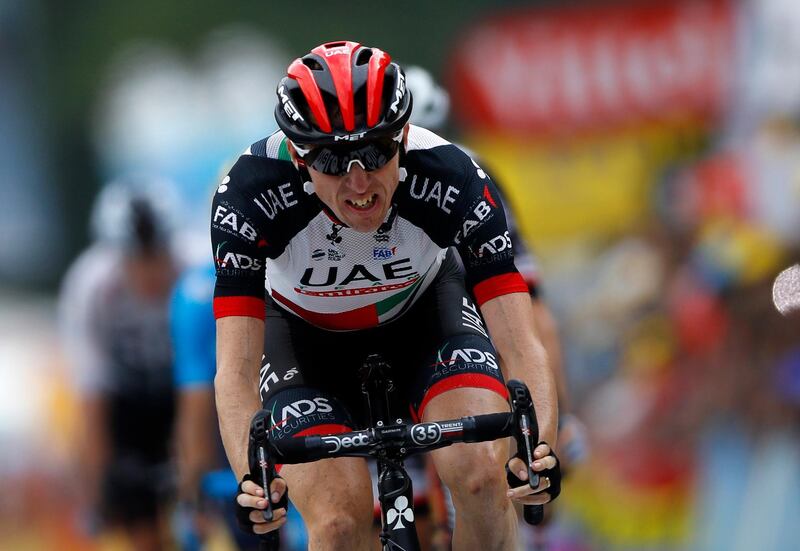epa06914206 UAE Team Emirates rider Daniel Martin of Ireland crosses the finish line during the 19th stage of the 105th edition of the Tour de France cycling race over 200.5km between Lourdes and Laruns, France, 27 July 2018.  EPA/KIM LUDBROOK