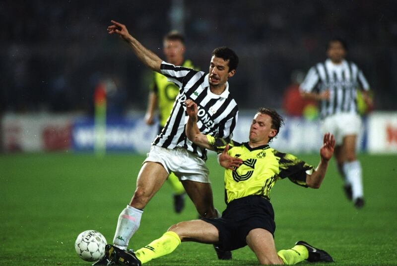 19 May 1993:  Gianluca Vialli of Juventus is tackled by Schmidt of Borussia Dortmund during the UEFA Cup final second leg at the Delle Alpi Stadium in Turin, Italy. Juventus won the match 3-0. \ Mandatory Credit: Shaun  Botterill/Allsport