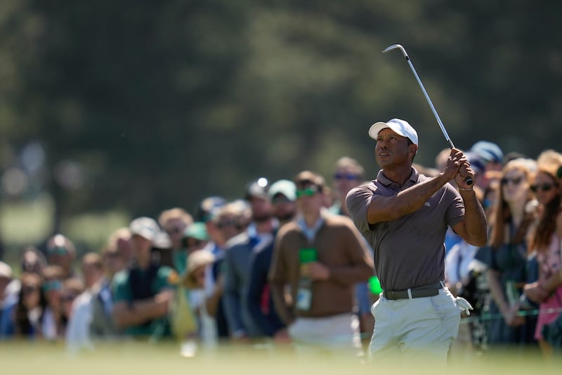 Tiger Woods watches his chip on the 18th hole during the second round in The Masters at the Augusta National Golf Club. AP