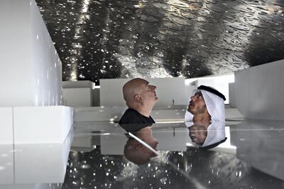 United Arab Emriates - Abu Dhabi - November 17th, 2009:  HE Sheikh Sultan Bin Tahnoon Al Nahyan (right), Chairman of TDIC, speaks with Jean Nouvel, the architect of the new Louvre Abu Dhabi, in a scale model of the dome material.  (Galen Clarke/The National) *** Local Caption ***  GC04_11162009_Louvre.jpg