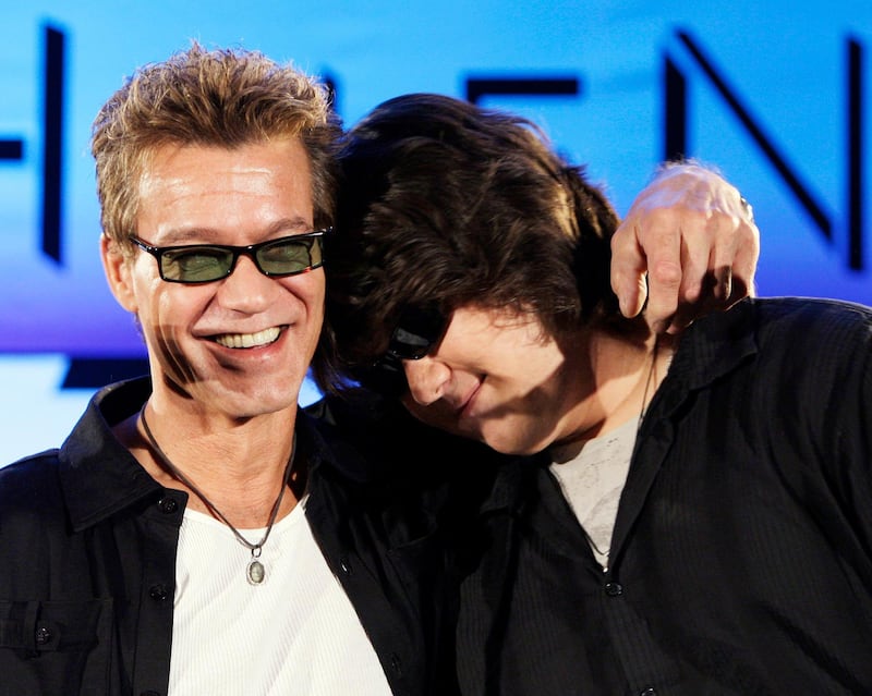 Eddie Van Halen, left, embraces his son Wolfgang Van Halen after the rock group Van Halen officially announced their North American tour during a news conference in Los Angeles on August, 13, 2007. AP Photo