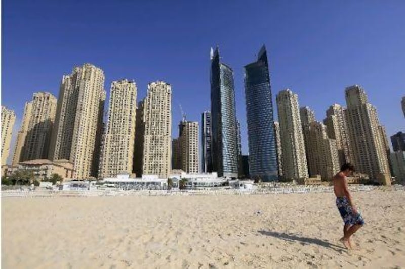Management of Meydan Beach, the low-slung structure in the foreground, say the private club "will enhance the leisure offering of the Dubai Marina district for both residents and visitors".