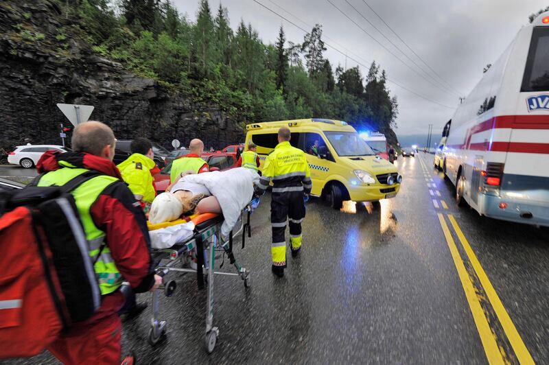 epa02837453 Norwegian rescue personnel take away an injured person that was brought ashore from a camp site at Utoya island near Oslo, early 23 July 2011. At least 84 people were killed in a shooting attack 22 July on a youth camp near Oslo, police said 23 July. A 32-year-old Norwegian man was suspected of the shootings and also for a bomb explosion in central Oslo that claimed seven lives the same day, Oslo deputy police chief Roger Andresen said. The death toll at Utoya island, west of Oslo, and the bomb explosion could rise, Andresen added. Police were to search the waters off the island. Andresen said police had no complete tally of injured or missing.  EPA/MORTEN EDVARDSEN NORWAY OUT *** Local Caption ***  02837453.jpg