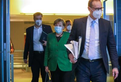 German Chancellor Angela Merkel, Bavarian State Premier Markus Soeder and Berlin Mayor Michael Mueller walk after a meeting with state leaders to discuss options beyond the end of the pandemic lockdown, amid the outbreak of the coronavirus disease (COVID-19), in Berlin, Germany, March 23, 2021. Michael Kappeler/Pool via REUTERS