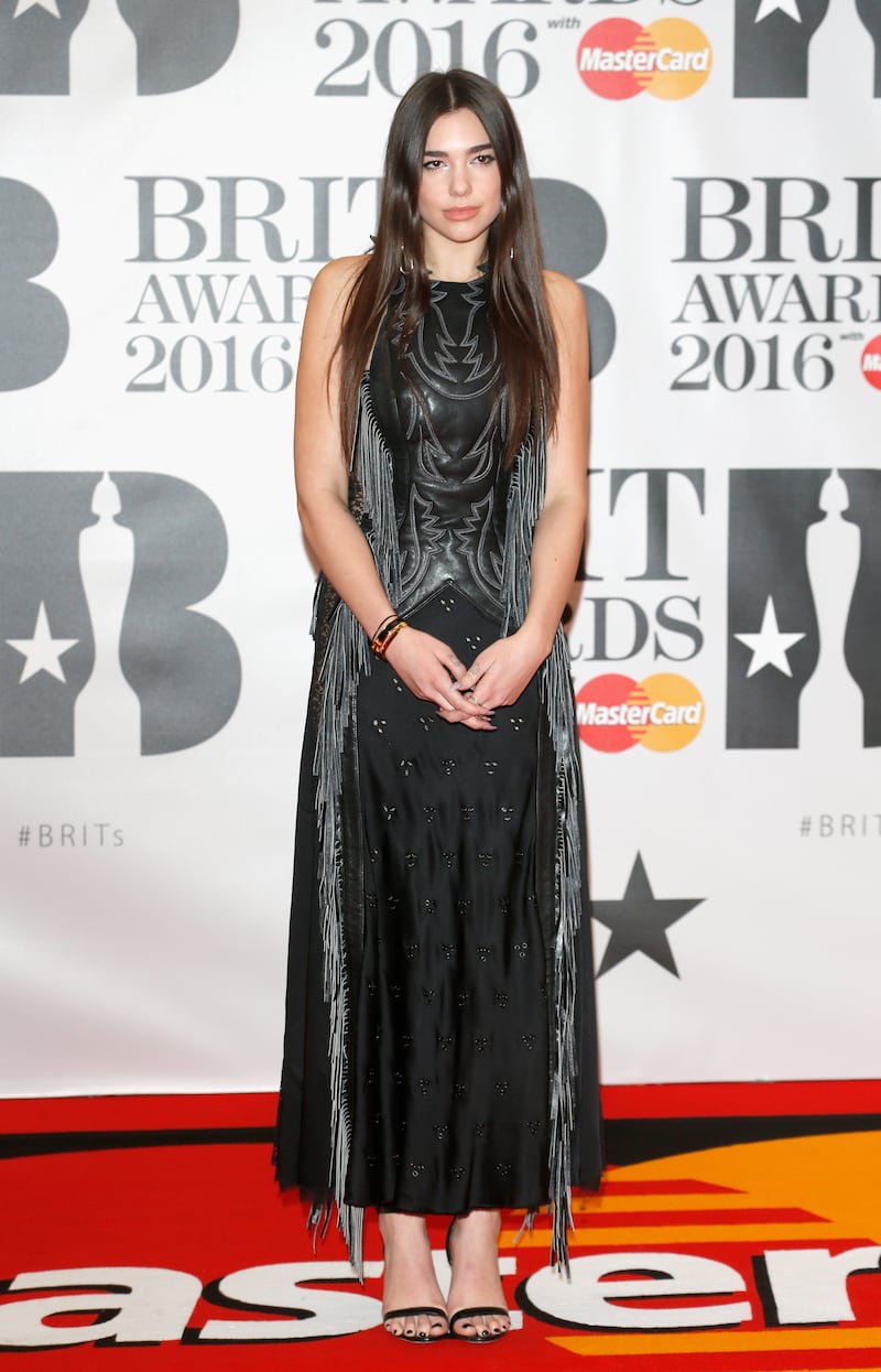 Dua Lipa, in a fringed maxi, attends the Brit Awards at The O2 Arena on February 24, 2016 in London, England. Getty
