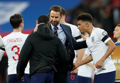 Soccer Football - Euro 2020 Qualifier - Group A - England v Czech Republic - Wembley Stadium, London, Britain - March 22, 2019  England's Raheem Sterling celebrates with Jadon Sancho and manager Gareth Southgate after the match  REUTERS/David Klein