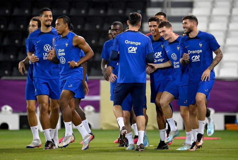 France players warm up before their training session at the Jassim-bin-Hamad Stadium in Doha. AFP